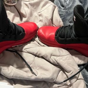 Red and Black Under Armour high tops youth size 6